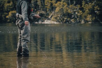 a fisherman in a lake