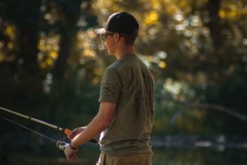 a man is fishing in the woods